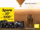Ein Löwe sitzt in einem Feld und im Hintergrund fliegt ein Heißluftballon. Daneben sind zwei Objektive, drei Kameras und ein Fernglas von Nikon zu sehen sowie folgender Text: "Spare von 50€ bis 1000€. 02.05. bis 21.07.2025."