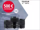 Drei Fujifilm Objektive befinden sich auf einem grau weißen Hintergrund. Auf der Grafik steht folgender Text: "500€ Sofortrabatt beim Kauf teilnahmeberechtigter GF Objektive. 01.02.2025 - 31.03.2025."