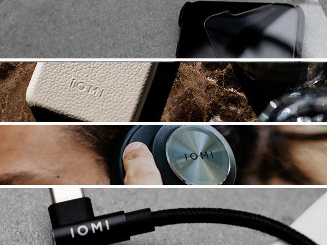 verschiedene IOMI-Produkte wie ein Ladekabel, Kopfhörer und eine Handyhülle