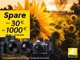 Nikon-Werbung mit Sonnenblumenfeld im Hintergrund. Links ein gelbes Aktionsfeld mit &bdquo;Spare von 30 &euro; bis 1000 &euro; (30.04.&ndash;27.07.2026)&ldquo;. Unten eine Auswahl an Nikon-Kameras und Zubeh&ouml;r. Oben rechts der Schriftzug &bdquo;Keep discovering&ldquo; und unten rechts das Nikon-Logo.